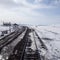 Train tracks on snowy landscape