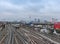 Train tracks with trains and the television tower