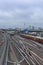 Train tracks with trains and the television tower