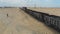 Train. Train in Mauritania. Train carrying coal. Industry in Mauritania. Filming from a drone. Footage. Mauritania in 4k. Africa