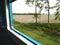 Train travel through agriculture field journey passenger window seat