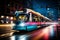 a train traveling down a city street at night