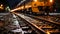 a train traveling down the tracks at night