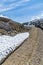 A train travels through a snow lined cutting at the highest point of the White Pass and Yukon railway near Skagway, Alaska
