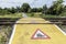 Train warning sign at a railroad crossing