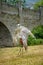 Trained large captive funny-looking saker falcon raptor bird on town festivities at the old castle