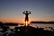 Trained male body silhouette on the beach at sunset