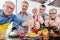 Trainees and their nutritionist in a training kitchen showing thumbs