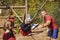 Trainer assisting a boy in obstacle course training