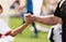 Trainer and child shaking hands after playing soccer football final game