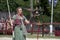 Trainer dressed in medieval costume demonstrates hawks abilities at the annual Bristol Renaissance Faire