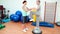 Trainer helping elderly client to use bosu ball