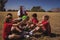 Trainer instructing kids while exercising in the boot camp