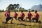 Trainer instructing kids while exercising in the boot camp