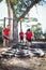 Trainer instructing kids during tyres obstacle course training