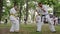 Trainer karate spend martial arts training into park, groups children in kimono participate in kyokushin outdoors, sport