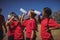 Trainer and kids drinking water in the boot camp