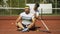 Trainer massaging shoulders of plump tennis player