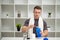 Trainer prepares a protein shake in the shaker after training