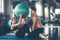 Trainer training yoga ball and exercise with  woman at the gym for healthy care and body slim.  Fitness instructor exercising with