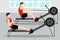 Training athletes on a rowing machine in the gym