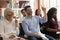 Training audience participants raise hands to ask question at workshop