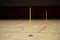 Training cones on hardwood court floor. Basketball, futsal, handball and volleyball practice. Game Equipment Horizontal sport them