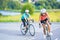 Training cycle of the two female caucasian sportswomen riding s