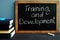 Training and development handwritten on a blackboard