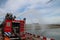 Training with extinguish water jets by the fire brigade in harbor 6100 in the port of Rotterdam in the Netherlands.