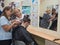 Training haircut. The teacher teaches the student male haircuts. Russia. Saint-Petersburg.