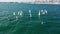 Training with optimist dinghy sailing boats near the Real Club Nautico de Valencia, Spain.