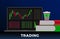 Training trading in financial stock markets, forex or cryptocurrencies concept. A laptop with stock charts graph on the screen