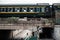 Trains crossing a bridge, with a car nearby in Wuhan, China