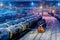 Trains of oil tanks and wagons on the cargo railway station