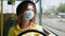 Trains are pandemic, girl observes precautions and rides in bus in medical mask to protect against virus and infection