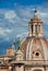 Trajan Column, baroque dome and Quirinal Hill in Rome