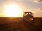 Traktor in sunset