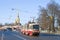 Tram 6 of the route against the spire of the Peter and Paul Cathedral on April Day. Saint Petersburg