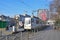 A tram of Bucharest light rail along Bulevardul Ion C. Bratianu with clock & large billboard in Bucharest, Romania