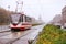 Tram and cars on the street of St. Petersburg foggy rainy autumn day