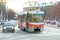 Tram at the crossroads. Street traffic in winter