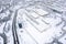 tram depot in winter. trams, tramway tracks and industrial buildings covered with snow. aerial photo