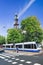 Tram with famous Wester Tower on background, Amsterdam, Netherlands.