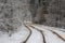 Tram line rails in the snow-covered forest in Kyiv. Ukraine