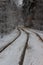Tram line rails in the snow-covered forest in Kyiv. Ukraine