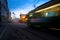 Tram passing Helsinki Senate Square during sunset with Helsinki