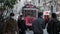 Tram and pedestrians in face masks on famous Istiklal Avenue