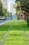 Tram railways closeup decorated by green grass