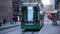 Tram rides down the street in the city center